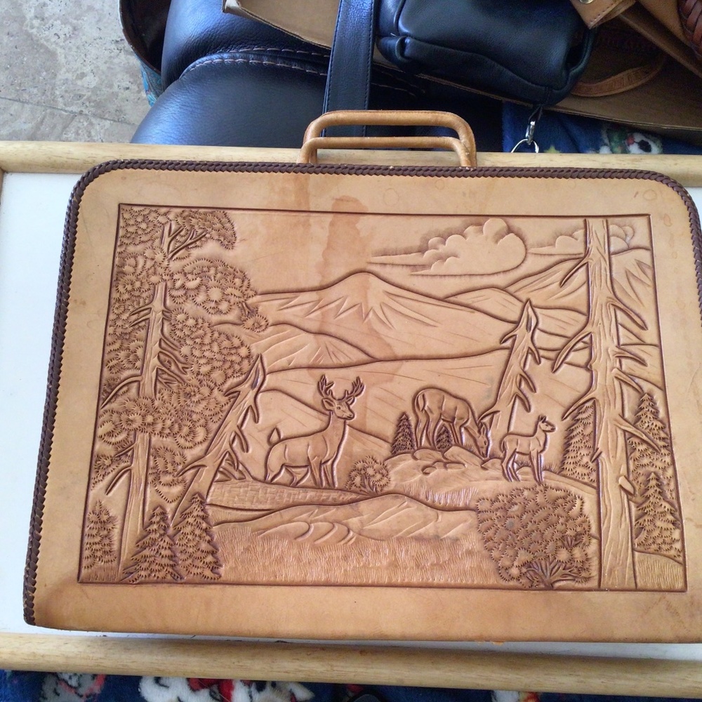 Leather two pocket briefcase. Hand tooled forest scene.